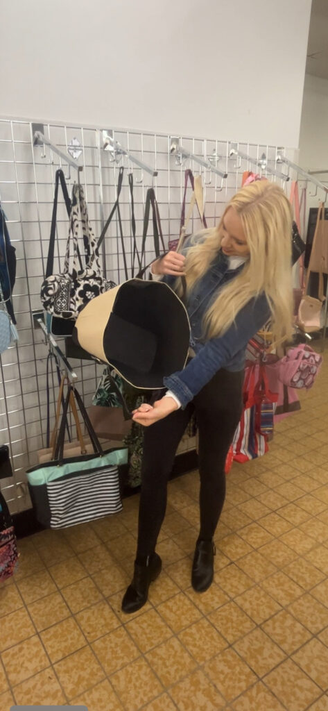 Julie Holiday looking at purses at the Northfield Goodwill location.