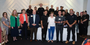 Group photo of Guy's Party Center's team receiving the Mary Beth Kluge "Making a Difference" Award